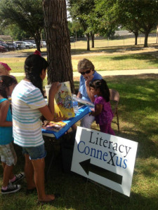 Picking out books at a Hunger Fair